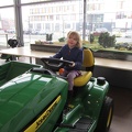 Amelia and big lawn tractor.JPG
